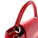 Taurillon Capucines PM Rubis